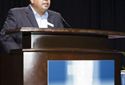F&I and Showroom magazine"s Executive Editor Greg Arroyo at the podium