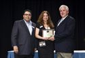 F&Idol finalist Chris Bell of Freehold Buick GMC receives a plaque for Best Tire and Wheel Presentation.