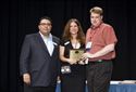 F&Idol finalist Joe Lawrence of Metro Imports receives a plaque for Best Key Replacement Presentation.