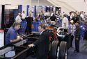 Doing business over a beautiful new chassis on the show floor.