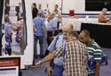 Attendees looking at products on the show floor.